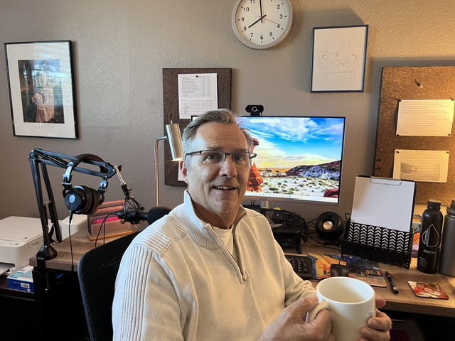 Peter in his office, where he conducts virtual therapy sessions